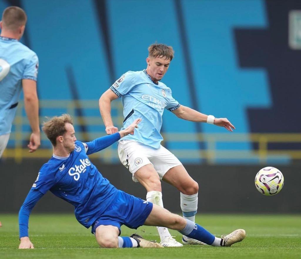 Elite Football Coaching - Professional tackle in action
