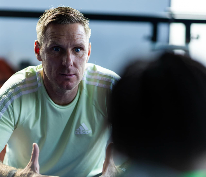Leadership & Team Dynamics - Coach providing one-on-one mentoring and guidance