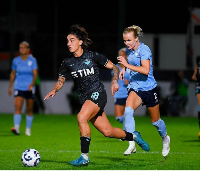 Psychological Resilience - Professional women's football match showing competitive intensity